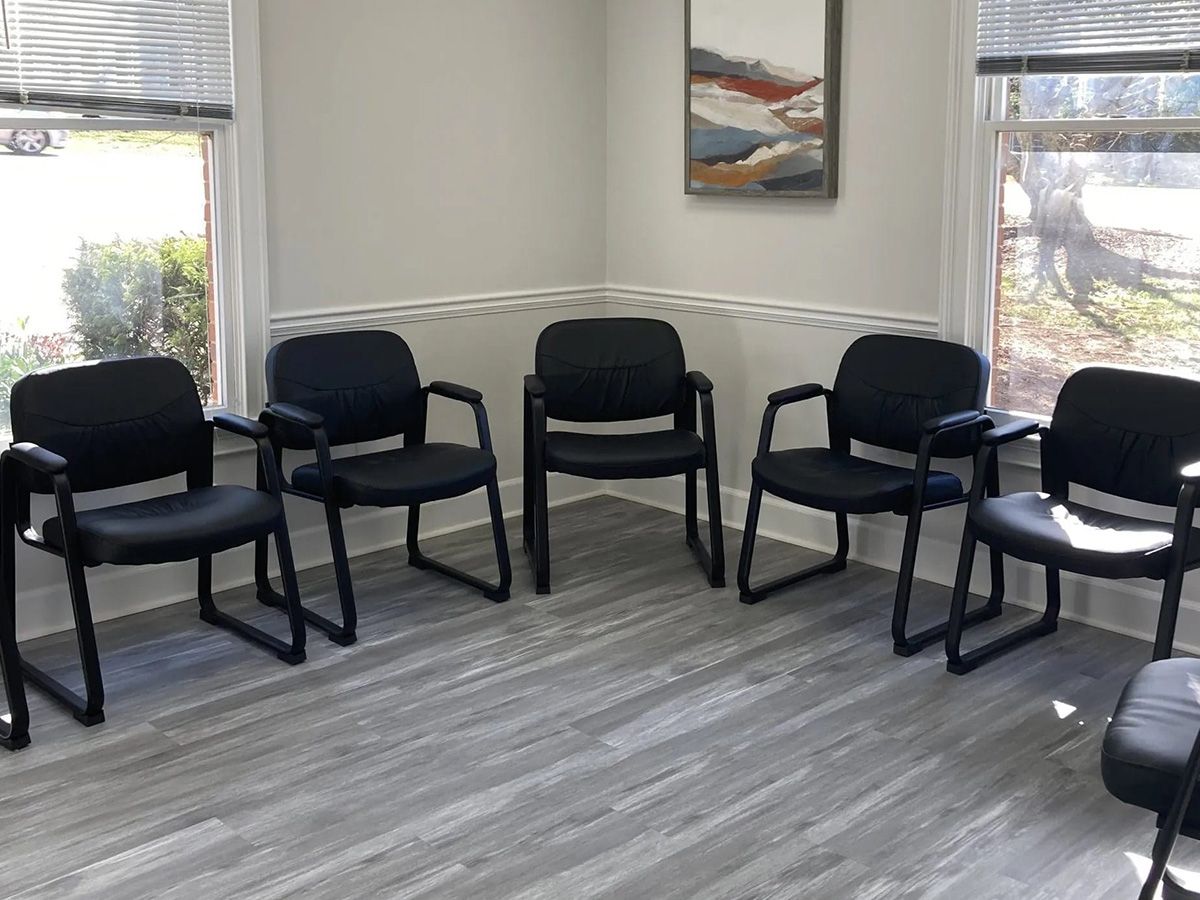 family in therapy session during addiction treatment at our drug and alcohol rehab in Atlanta, Empowered Recovery Center.